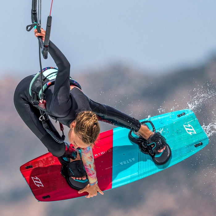 Freestyle kiteboarder in the air riding with a North short kite safety leash