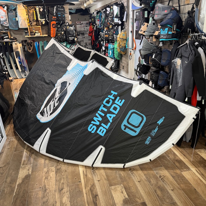 2026 Cabrinha Switchblade 10m used kite in black and blue, shown inflated outdoors