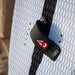 Close up of the the Reedin Layflat foot strap mounted on a Reedin Feather board