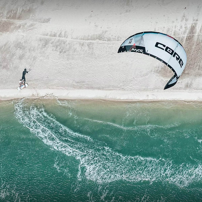 Kitesurfer on the beach with a Core Kiteboarding Kite
