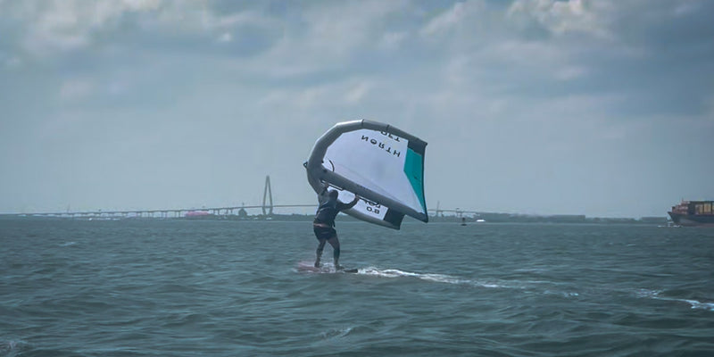 Guy learning how to wing foil in Charleston bay