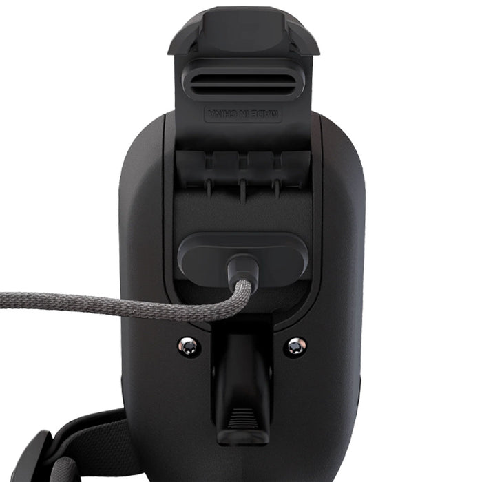 close up view of Lift E-Foil Hand Remote Controller with charging cable plug into the charing port on a white background